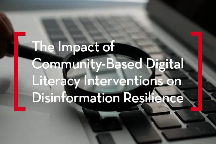 A person holds a magnifying glass over a laptop keyboard. Overlaid text reads, The Impact of Community-Based Digital Literacy Interventions on Disinformation Resilience. Red brackets frame the text.