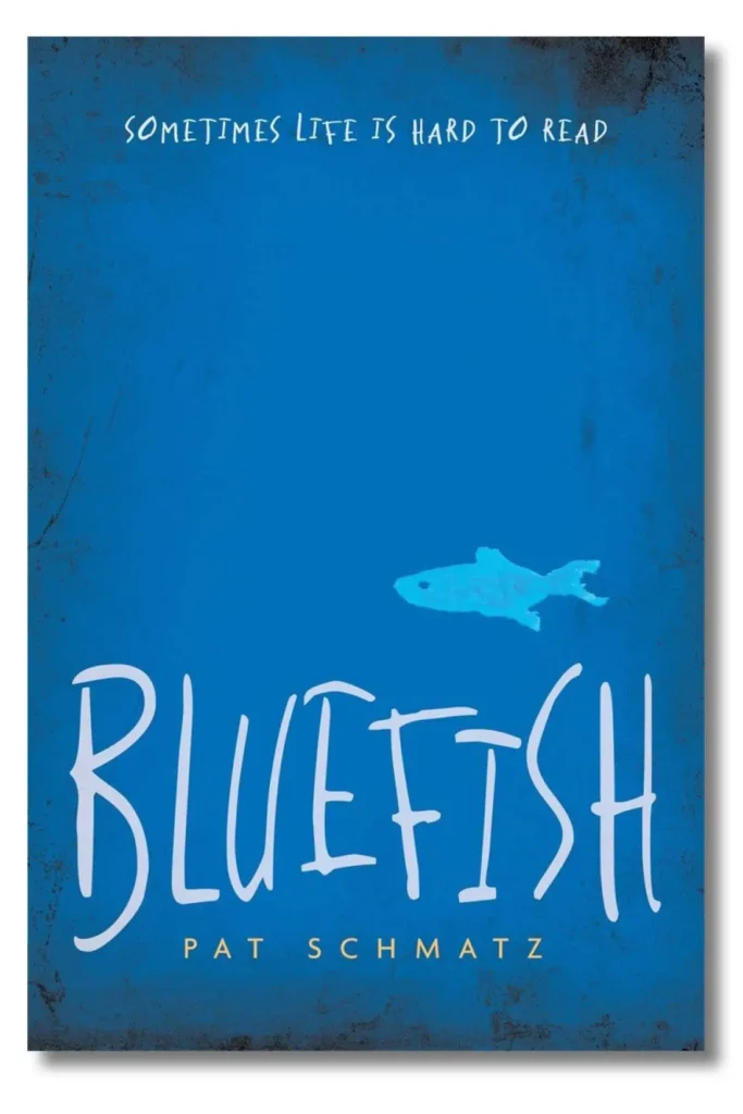 A blue book cover with a small fish illustration and the title BLUEFISH in large white letters. Above, it says Sometimes life is hard to read. At the bottom is author Pat Schmatz, winner of the PEN Naylor Grant for Children’s and Young Adult Novel.