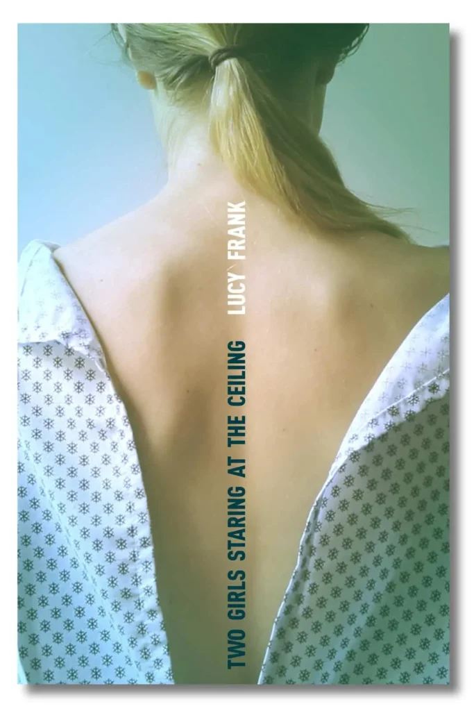 A woman with blonde hair in a ponytail, seen from behind, wears a hospital gown open at the back. The text reads TWO GIRLS STARING AT THE CEILING and LUCY FRANK—PEN Naylor Grant Children's and Young Adult Novel—down her spine.