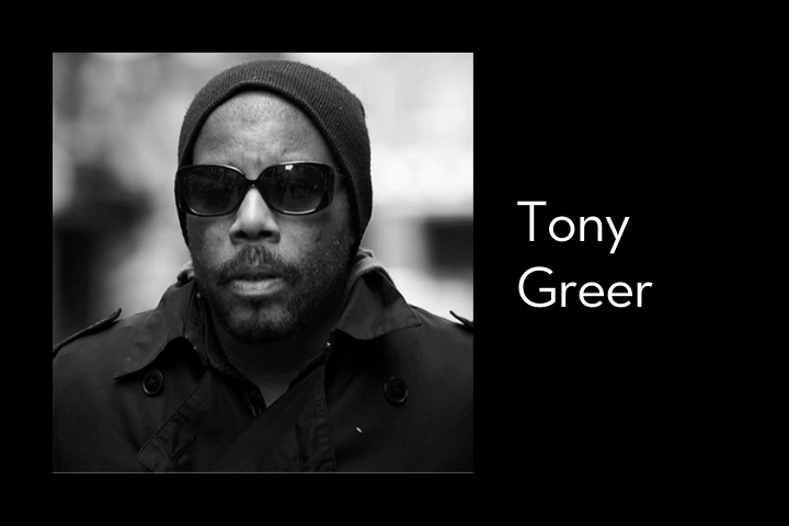 Black and white photo of a man wearing a beanie, sunglasses, and a trench coat. Next to the photo, the name Tony Greer is written in white text on a black background.