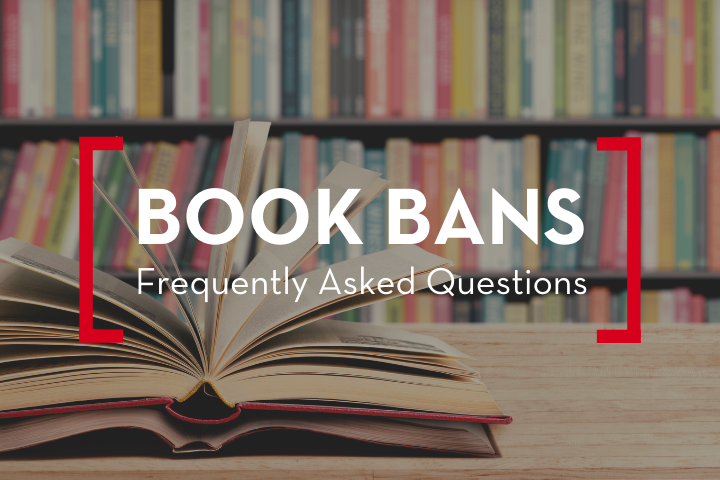 An open book sits on a wooden table in front of a colorful bookshelf. Overlaid text reads, Book Bans: Frequently Asked Questions, framed by red brackets—highlighting the ongoing conversation around book bans.