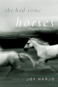 Book cover for She Had Some Horses by Joy Harjo, from a reproductive rights reading list, featuring a blurred black-and-white image of two white horses running, with the title and author’s name overlaid on the image.