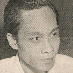 A black-and-white portrait of a young man with short, neatly combed hair, gazing slightly to the side with a calm expression. He is wearing a light-colored shirt.
