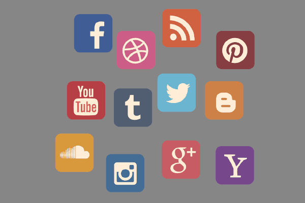 A collection of colorful social media icons, including Facebook, Dribbble, RSS, Pinterest, YouTube, Tumblr, Twitter, Blogger, SoundCloud, Instagram, Google+, and Yahoo, arranged on a gray background.