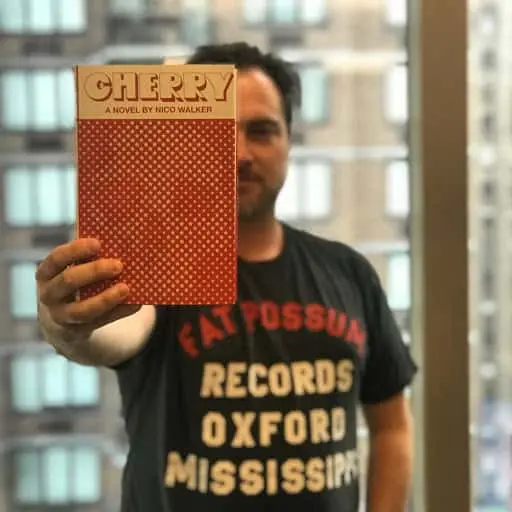 Tim O'Connell holding Cherry by Nico Walker