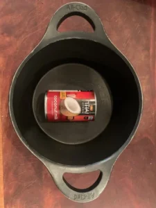 Can of coconut milk in a pot