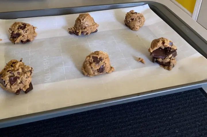 Shaped dough balls of chewy chocolate chunk cookies