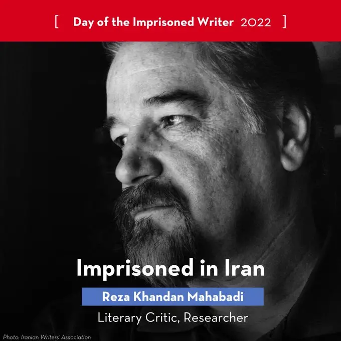 Black and white portrait of Reza Khandan Mahabadi looking to the side, with text overlay stating he is imprisoned in Iran and identified as a literary critic and researcher. The image marks the Day of the Imprisoned Writer 2022.