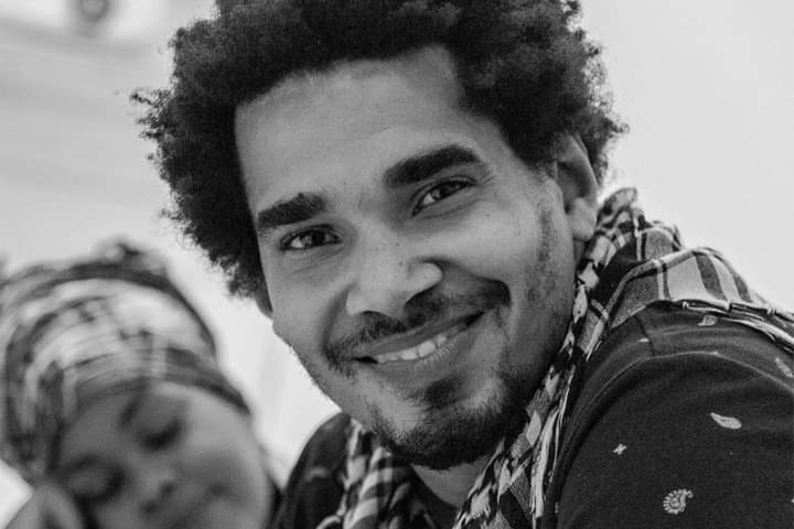 A man smiling at the camera.