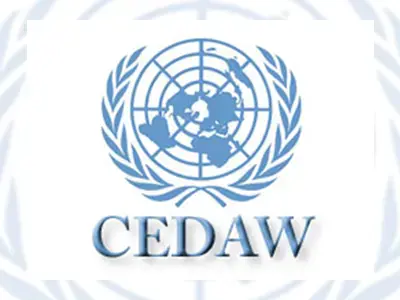 Blue United Nations emblem with a world map surrounded by olive branches above the acronym CEDAW on a white background.