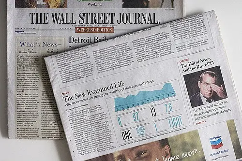 Two Wall Street Journal newspapers; the top one features a story about Nixon, a chart, and a headline The New Examined Life, while the one underneath shows the masthead.