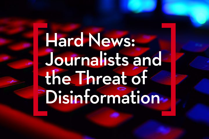A close-up of a keyboard glowing with red and blue lights. Overlaid white text reads: Hard News: Journalists and the Threat of Disinformation framed by two red brackets.