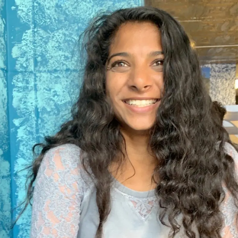 A woman smiling for the camera.