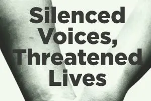 The image depicts two arms crossed at the wrists against a light background, with the bold, dark text Silenced Voices, Threatened Lives illustrating the struggle of those unheard.