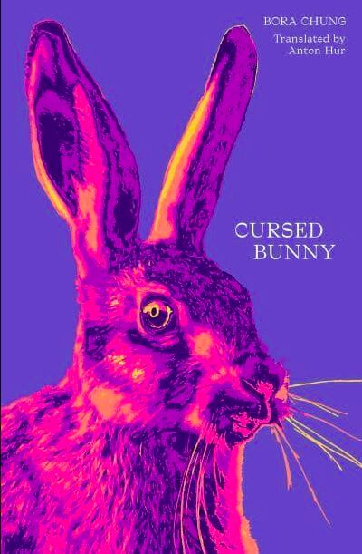 Book cover for Cursed Bunny by Bora Chung, translated by PEN/Heim Translation Fund recipient Anton Hur, featuring a close-up, neon pink and purple illustration of a rabbit’s head on a solid purple background.