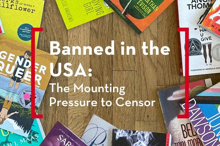 A collection of colorful books on a wooden floor surrounds white text that reads, Banned in the USA 2023: The Mounting Pressure to Censor. The books spines and covers are partially visible.