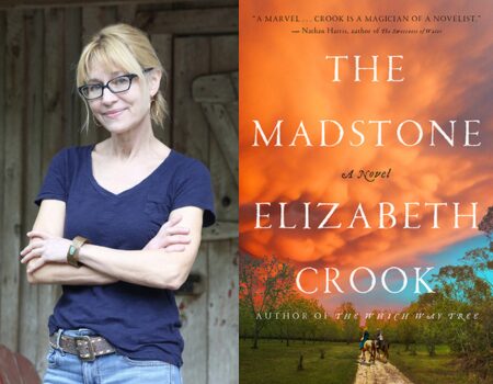 A woman with glasses and a blue t-shirt stands with folded arms next to the cover of the book The Madstone by Elizabeth Crook, which features a sunset sky over a rural landscape.