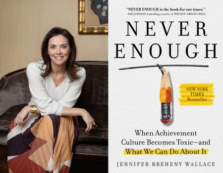 A woman in a white top and colorful skirt sits smiling on a couch beside the cover of the book Never Enough: When Achievement Culture Becomes Toxic—and What We Can Do About It by Jennifer Breheny Wallace.