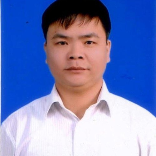 A man with short black hair wearing a white collared shirt poses for a formal portrait against a solid blue background, reminiscent of images seen in reports such as the Joint Press Statement on Trial of Vietnamese Writer Nguyen Vu Binh's Trial.