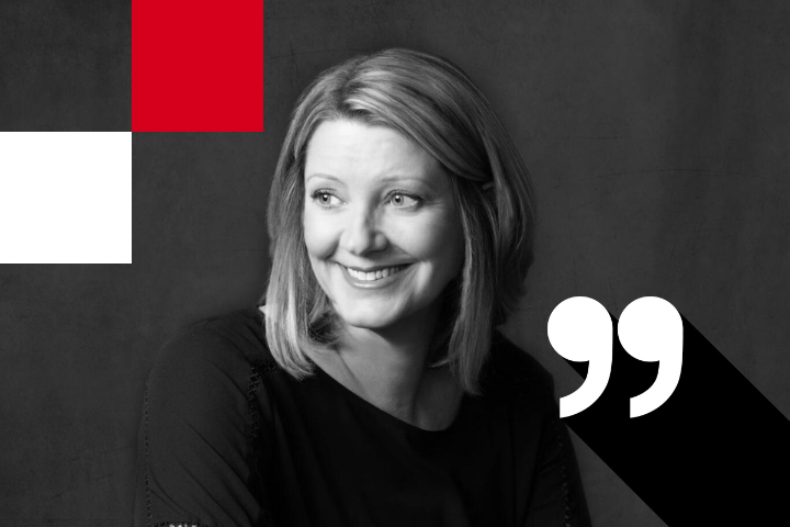 Woman with shoulder-length hair smiling, looking to the side. The background is grayscale with red and white squares in the corner and a large quotation mark symbol on the right.
