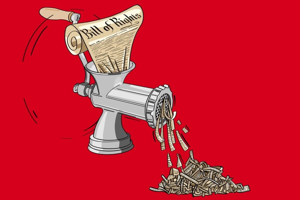 A scroll labeled Bill of Rights is being put through a metal meat grinder, coming out the other end as shredded pieces, set against a solid red background.