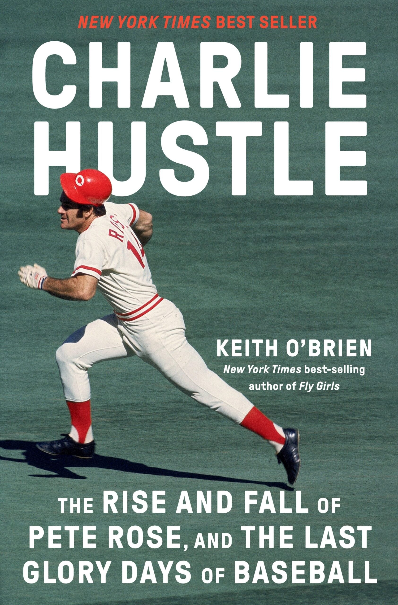 A baseball player in a white uniform and red helmet runs on a green field. The book title Charlie Hustle and subtitle about Pete Rose are overlaid, with the author Keith OBriens name in the corner.