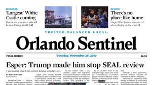 Front page of the Orlando Sentinel newspaper with headlines about the Largest White Castle coming, no place like home for sports, and Esper stating Trump made him stop SEAL review. Date: Tuesday, November 26, 2019.