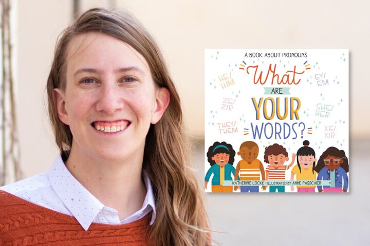 A smiling person with long, light brown hair stands next to the cover of a children’s book titled “What Are Your Words?,” featuring diverse illustrated children and various pronouns in colorful text.