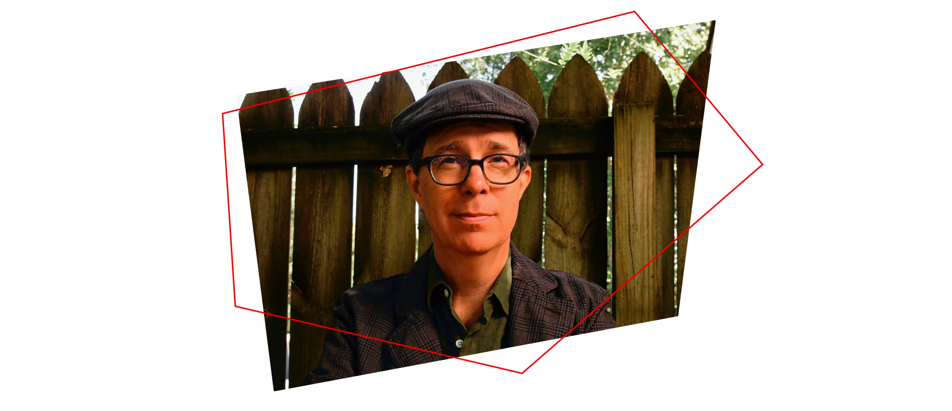 A person wearing glasses, a flat cap, and a dark jacket sits in front of a wooden fence, with sunlight filtering through trees above. Two geometric red lines frame the image.