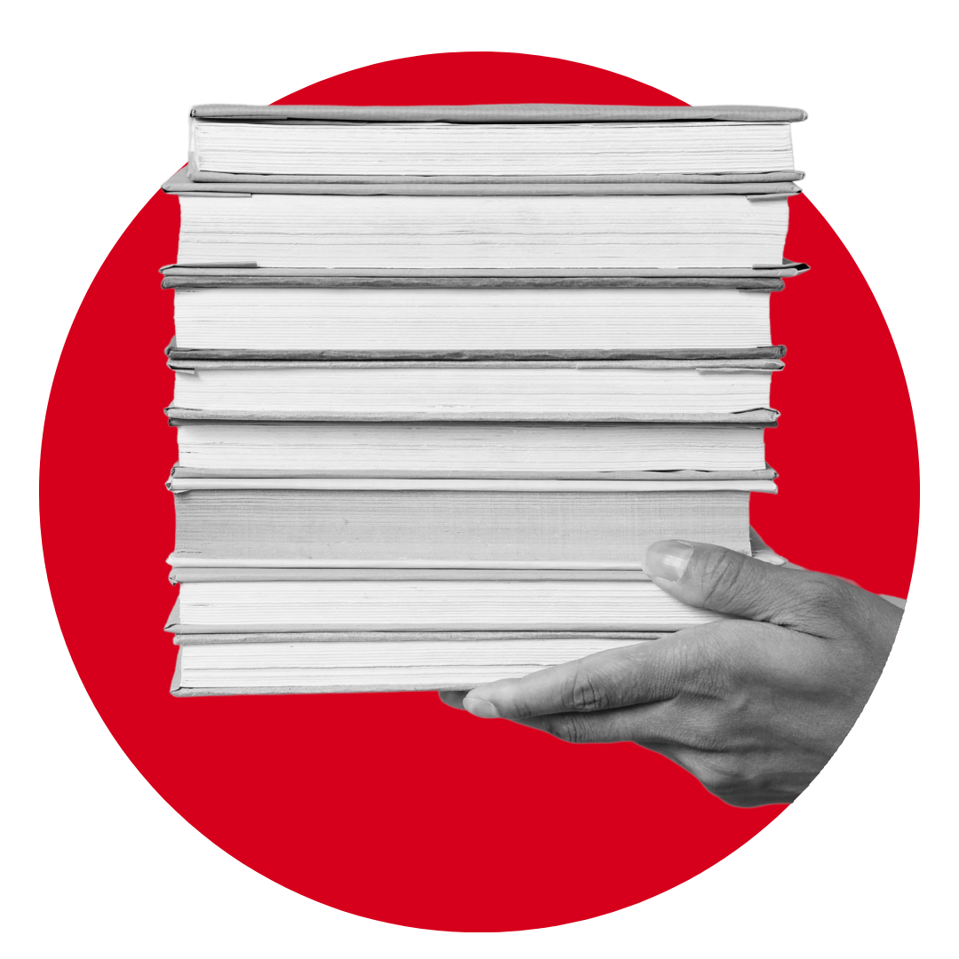 A hand holding a tall stack of hardcover books is shown in front of a solid red circle on a white background.