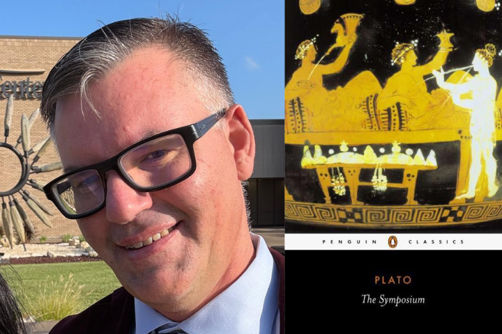 A man wearing glasses and a suit smiles outdoors near a building. Next to him is the cover of The Symposium by Plato, featuring ancient Greek artwork and the Penguin Classics logo.
