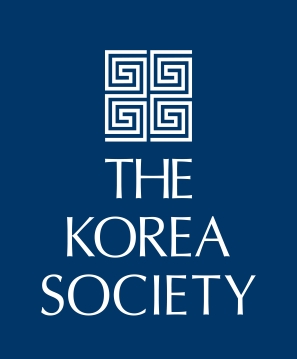A blue square logo featuring four white geometric spiral designs above the words The Korea Society in white capital letters.