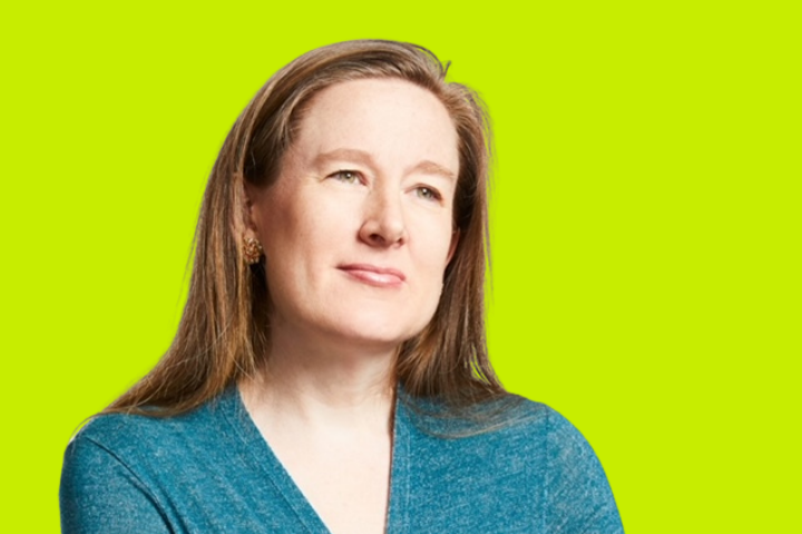 A woman with long light brown hair, wearing a teal top, looking thoughtful against a bright yellow-green background.