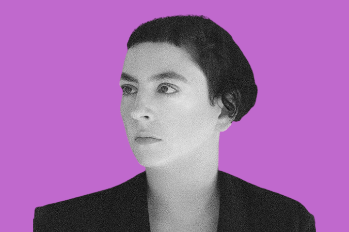 Black-and-white portrait of a person with short dark hair and a serious expression, looking to the side, set against a solid purple background.